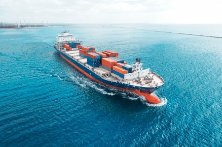 Aerial view of freight ship with cargo containers