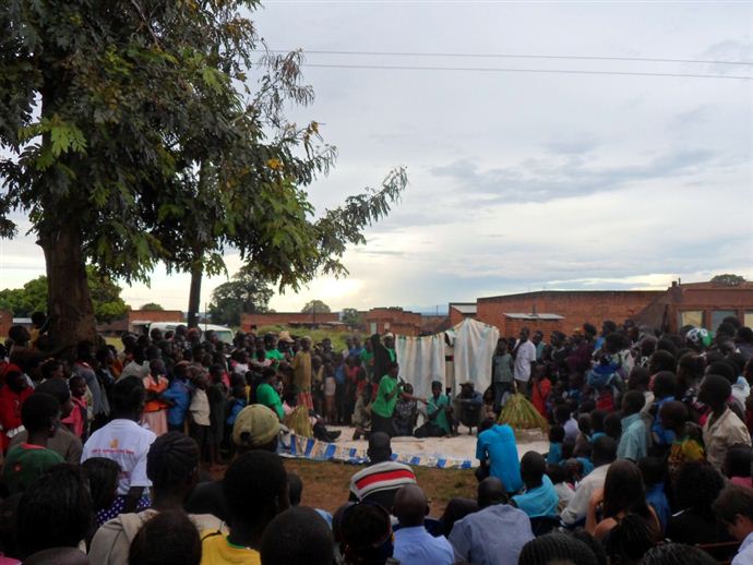 Group members on the South Sudanese border performing a play about how to solve land conflicts to their fellow community members. Group members on the South Sudanese border performing a play about how to solve land conflicts to their fellow community members.