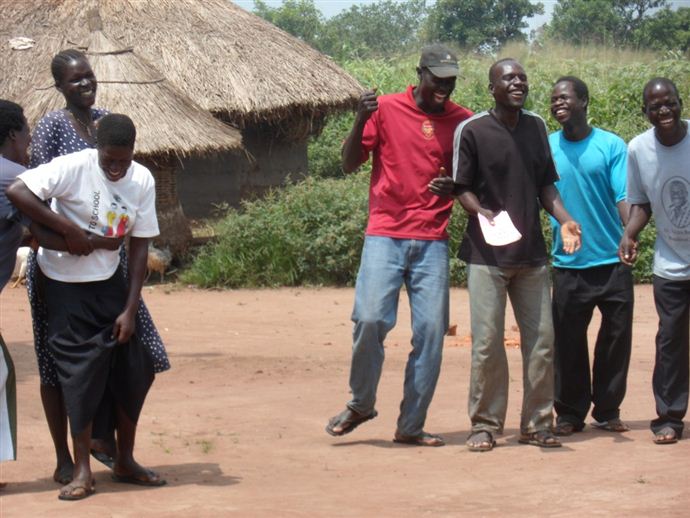 Members of Can Deg Wor (meaning ‘Poverty needs no quarrel’) sharing a joke while on a group activity. Members of Can Deg Wor (meaning ‘Poverty needs no quarrel’) sharing a joke while on a group activity.
